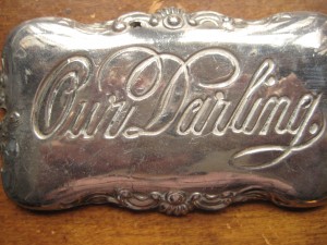 Metal plate from the casket of little Roy Emery who died about a month after his birth.